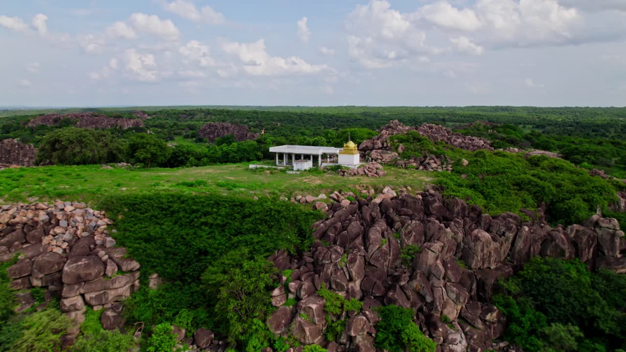 Sri rama Temple in the hill top with greenery, sky and clouds at yelupugonda village, Tekmal, telangana, india. day time, push in, drone shot, 4k.