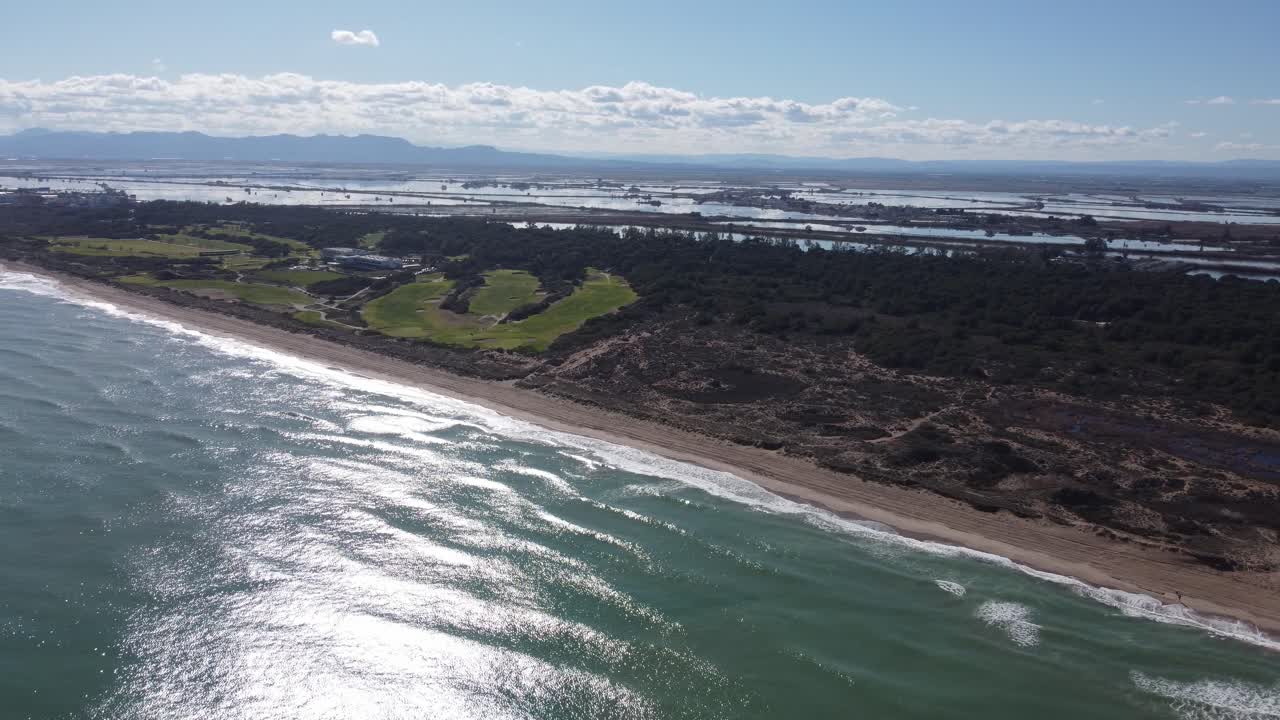 4K Slow Orbit Drone Shot Over Mediterranean Coast, Salt Flats, Pine Forest, and Golf Course in Spain
