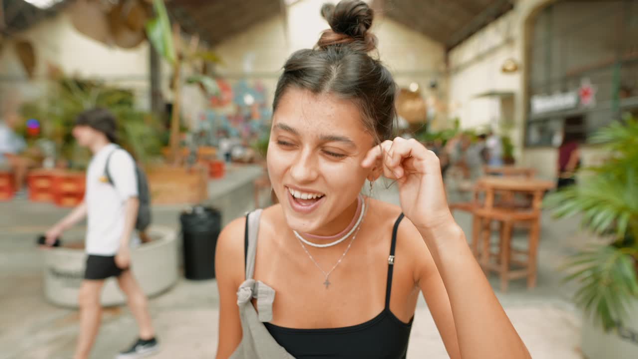 Portrait of a Young Woman in a Cafe