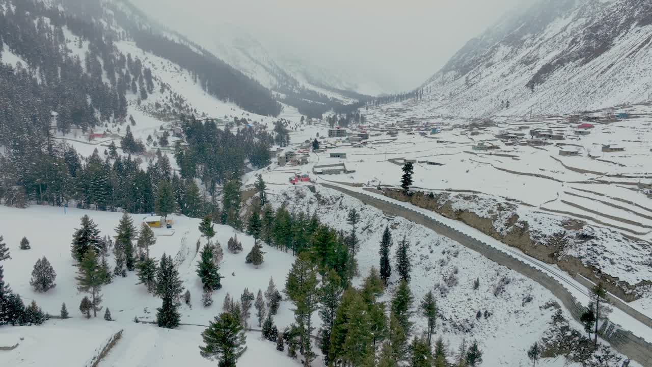 Snow covered naltar valley with beautiful snowy landscape in gilgit ...