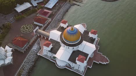 aerial footage - sunrise at a mosque, the melaka straits mosque