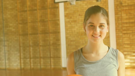 Animation-of-emoji-icons-over-happy-caucasian-woman-at-gym