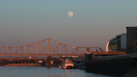 bridges span the ohio river near louisville kentucky at dusk