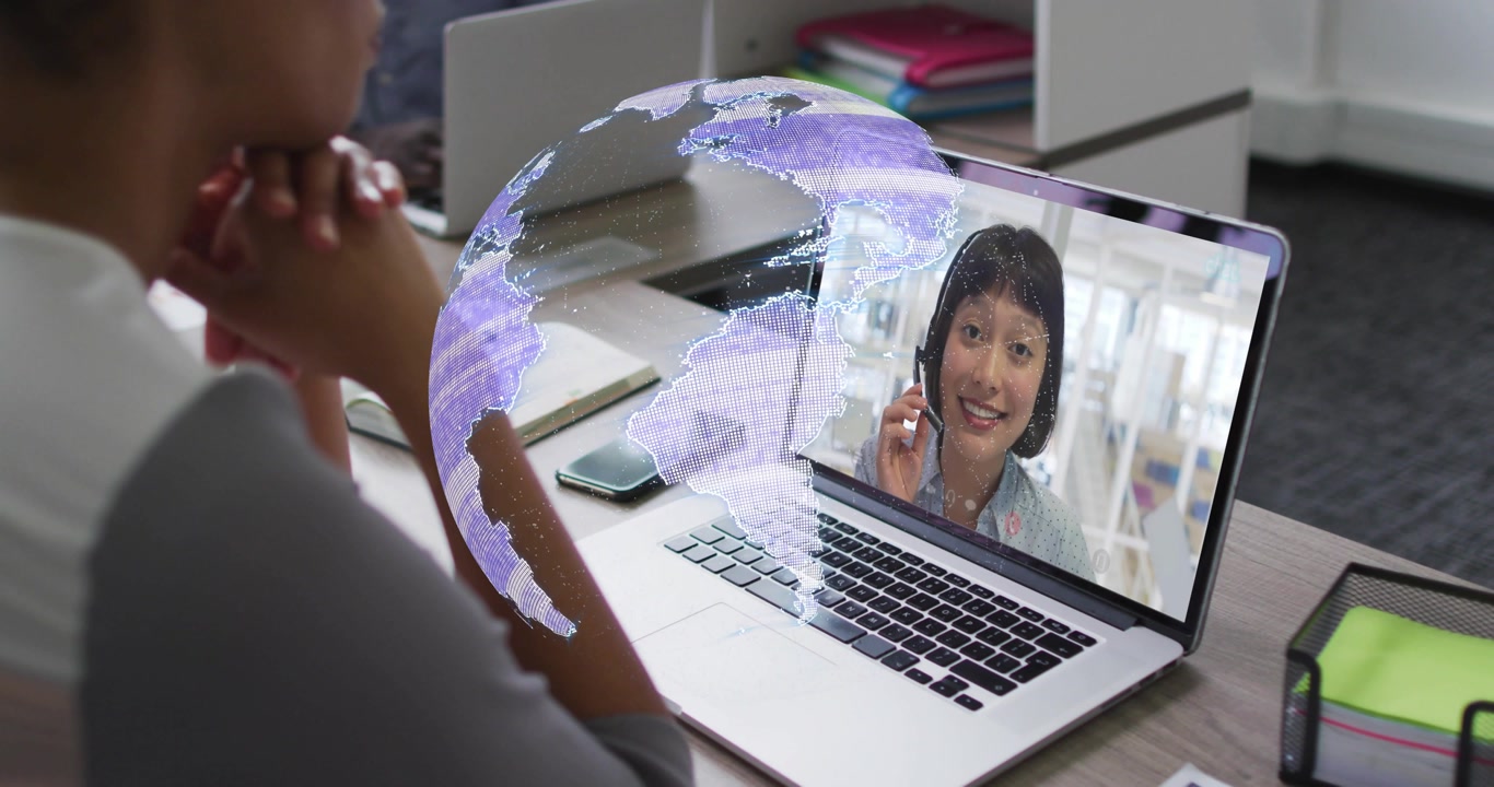 Woman joining business call on laptop, hologram forming, obscuring then revealing onscreen speaker