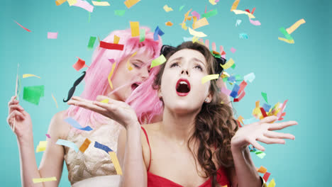 Girlfriends-dancing-wearing-red-dress-and-pink-hair-in-slow-motion-party-photo-booth