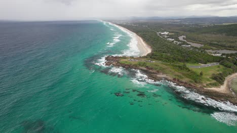 hastings point lookout and beach in nsw, australia - aerial pullback