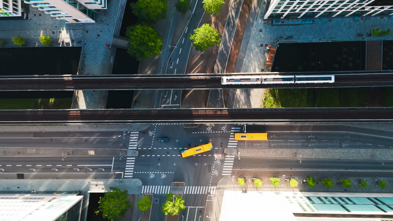 Aerial top down view of bus and metro public transport on street, Copenhagen