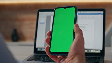 startuper finger swiping mockup smartphone at table closeup. man hand browsing