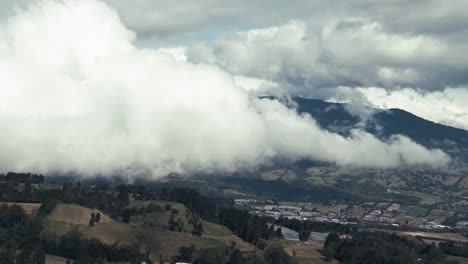 drone parallax shot of costa rica highland plains and rural valley landscape