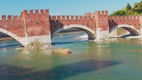 castelvecchio bridge, aka scaliger bridge, iconic landmark in verona, italy
with river under the bridge