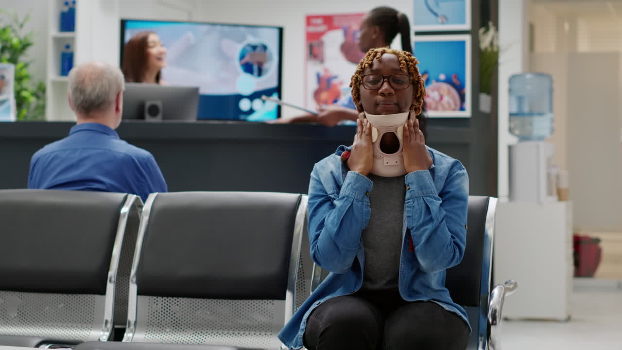Injured Woman Wearing Neck Brace in Hospital Waiting Room