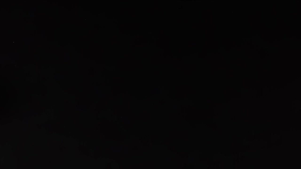 A series of frames showing a tennis ball moving across a dark background.