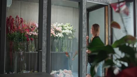florist arranging flowers in a shop