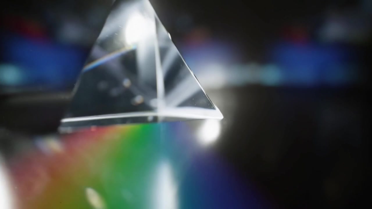Light Refracting Through a Glass Prism Creating a Rainbow Spectrum