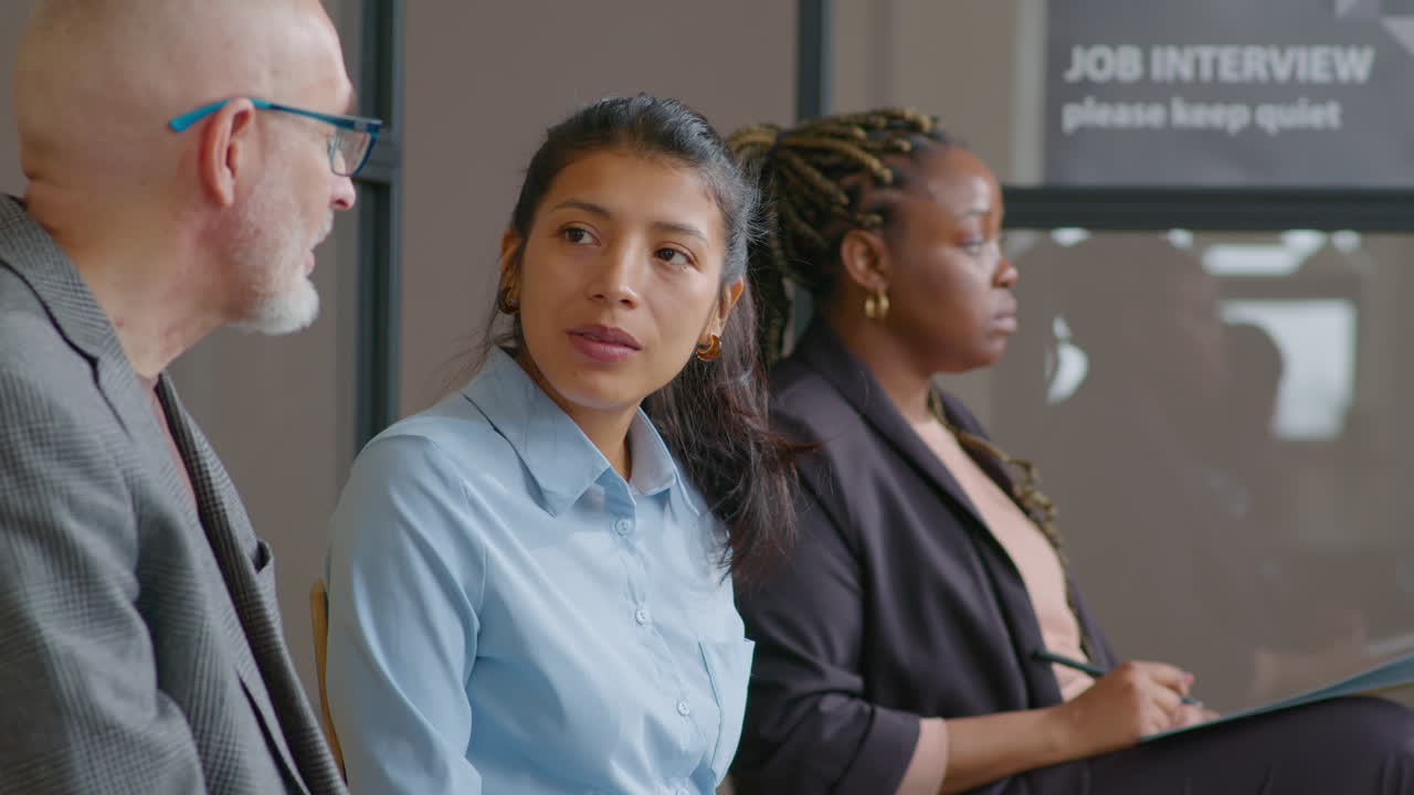 Hispanic Woman Speaking with Senior Man before Job Interview