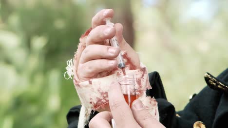 larp scene: a doctor picking a liquid from a bottle using a syringe, in order to heal a wounded comrade