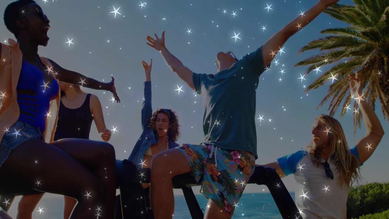 Friends on jeep at coast, sparkle overlay appearing across group, stepping, raising arms for travel