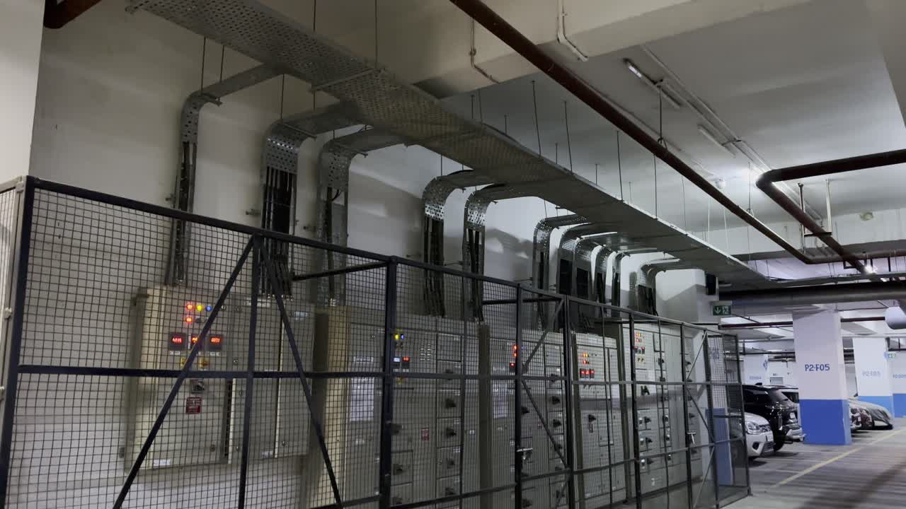 closeup shot showing a proper electric cable managment at the big scale with a combination of organized pathways, secure fixings, and clear labeling