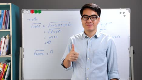 asian teacher making a thumb up