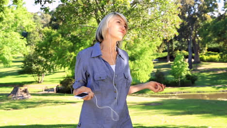 smiling woman listening to music