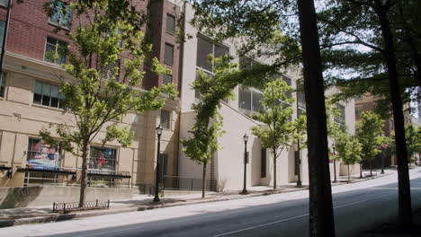 city street scene with parking garage and trees