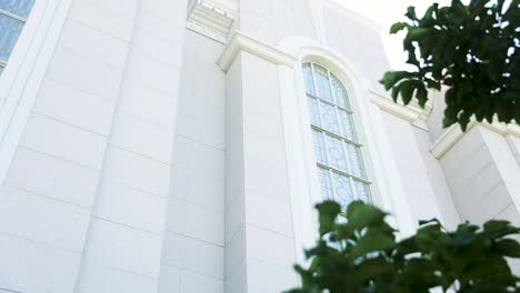 slow pan of white bountiful utah lds mormon temple stained glass windows