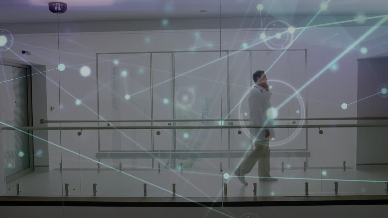 анимация сети связей и форм над двухрасовым врачом-мужчиной в больнице