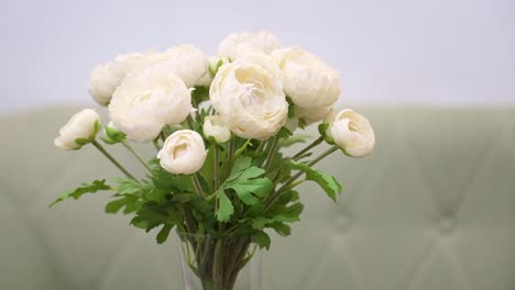 close-up of white flowers in a vase in a hotel lobby