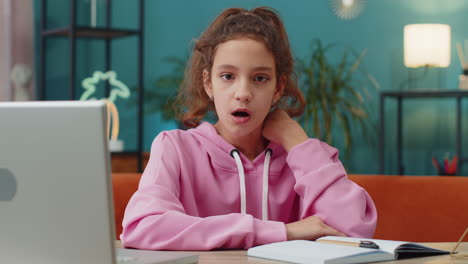 Excited school girl surprised shocked by sudden victory good win news celebrating wow reaction