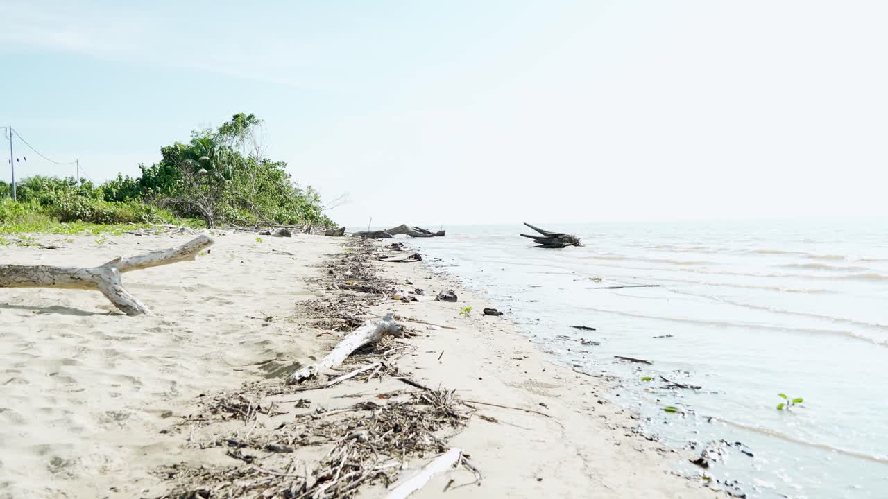 Summer View Of Alit Beach And Fishing Village Kabong,White Sandy Beach,Blue Sea ,Sky And Green Coconut Trees,Sarawak,Borneo.