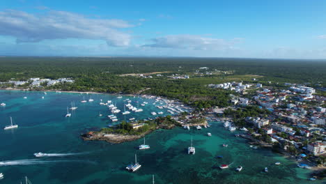 epic aerial view of a caribbean coast with boats and an amazing horizon in the morning