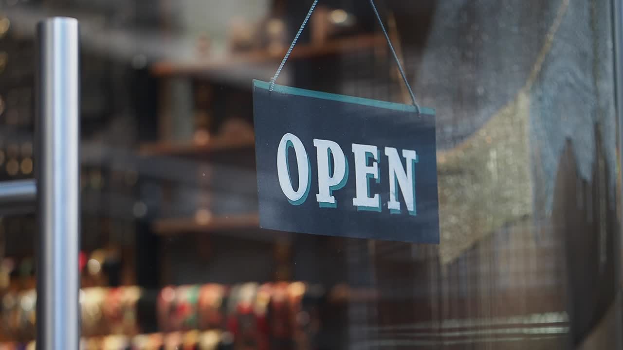 Close-up of an Open Sign in a Retail Store Window
