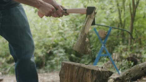 splitting wood with an axe.