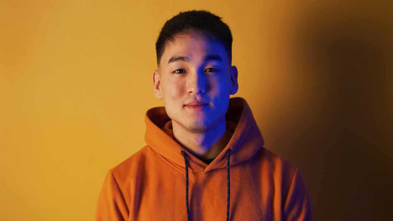 Portrait of a Man in an Orange Hoodie