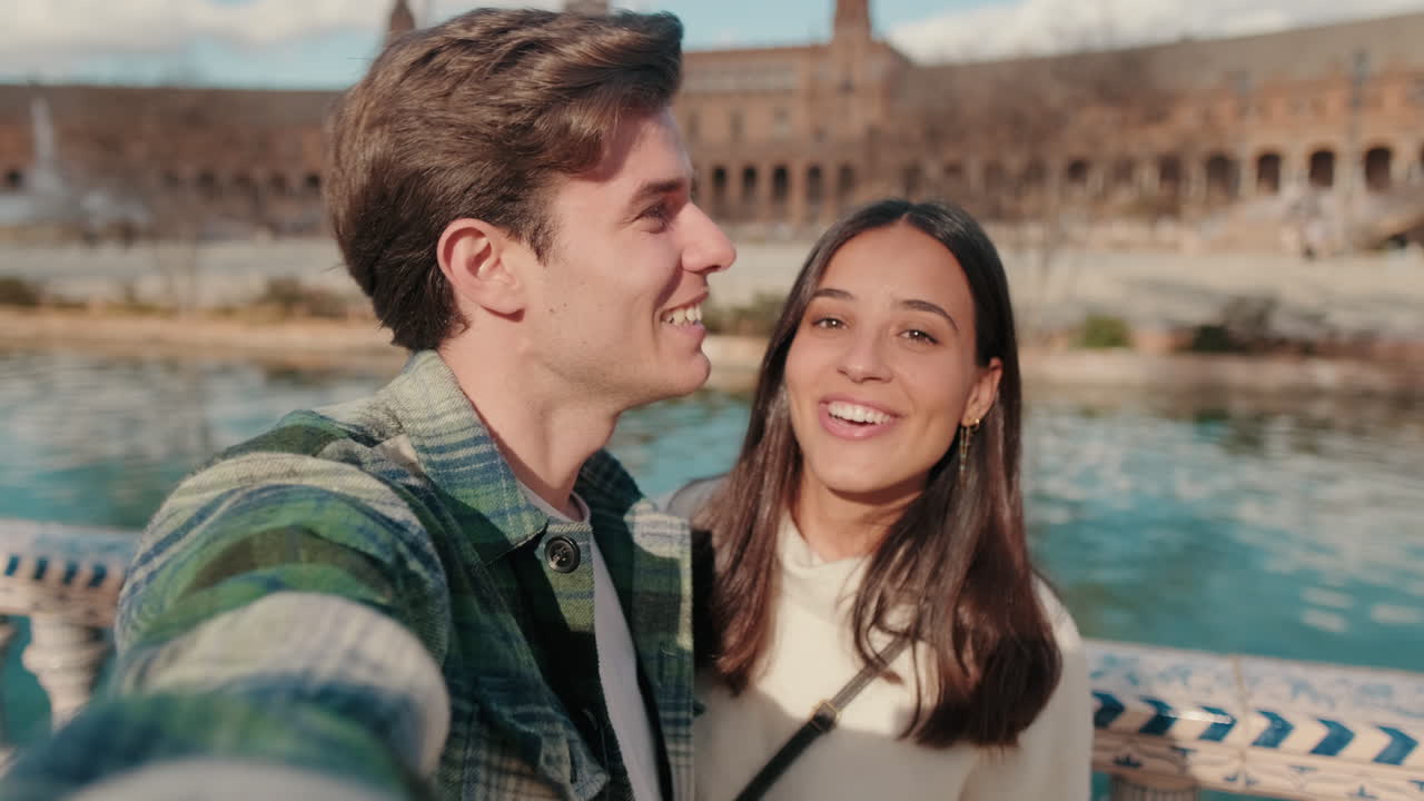 Happy young couple man and woman make video call, stream when they stand on the