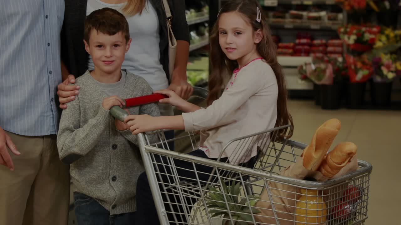 Family holding cart with baguette while grocery shopping, camera pulling back revealing data scan