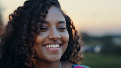 portrait of a smiling woman with curly hair