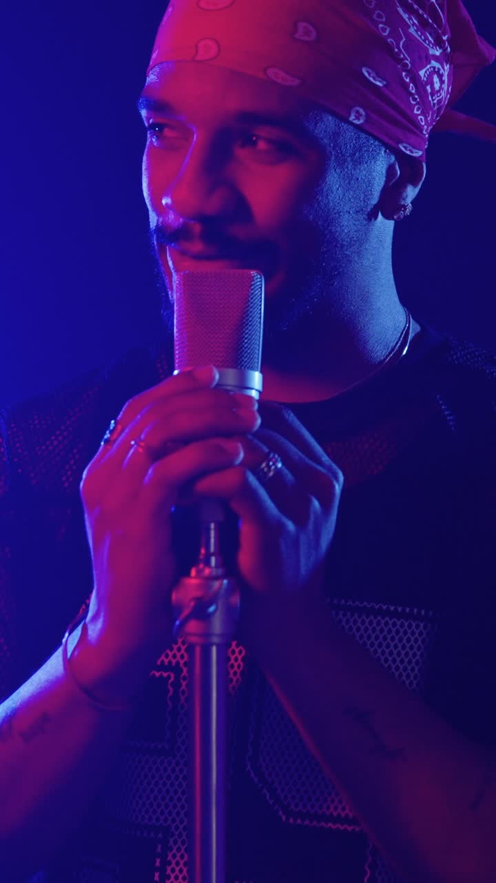 Man Singing into Microphone with Bandana