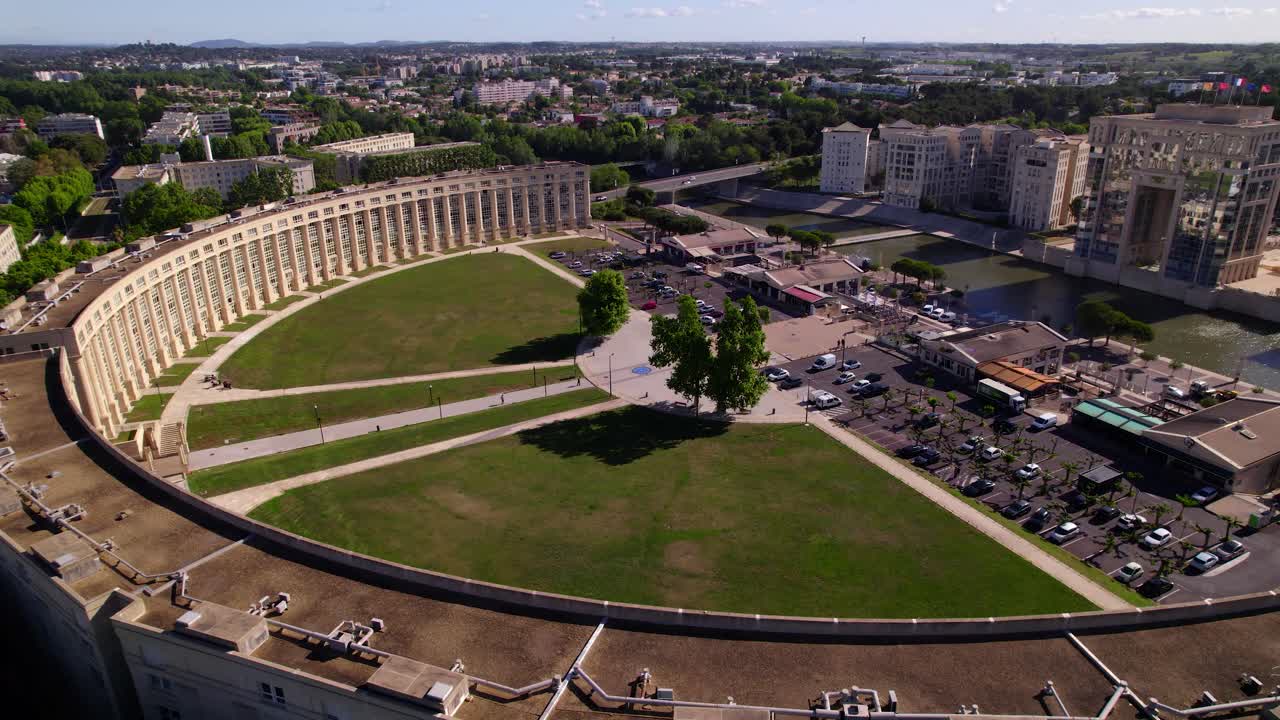 Aerial revealing shot of the Esplanade de l'Europe with an empty park during summer