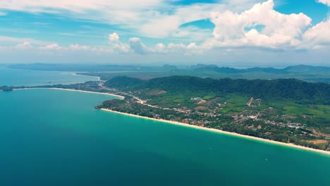 4K-Cinematic-nature-drone-footage-of-a-panoramic-aerial-view-of-the-beautiful-beaches-and-mountains-on-the-island-of-Koh-Lanta-in-Krabi,-South-Thailand,on-a-sunny-day