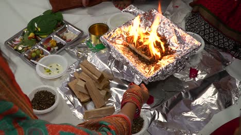 Close-Up-Of-Worshippers-Offer-Smaghri-Into-Fire-In-Havan-Ceremony-For-Navratri-1