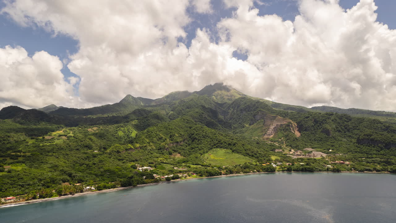 Hyperlapse of mount Pel&eacute;e in Martinique with fast moving clouds and a blue sky