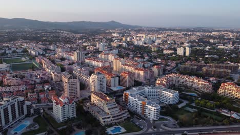 Ascending-Fly-By-of-a-Residential-Area-by-the-Coast-in-Cascais,-Portugal