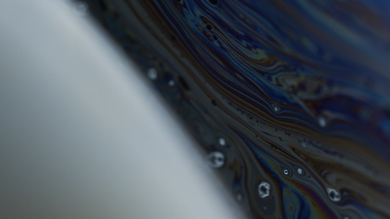Macro Shot of Bubble Surface with Rainbow Colored Hues on Surface