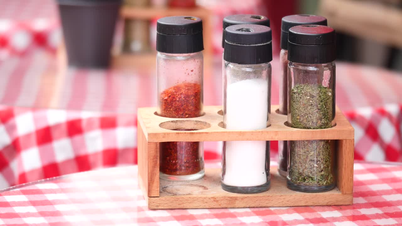 Wooden Spice Rack with Bottles on Table