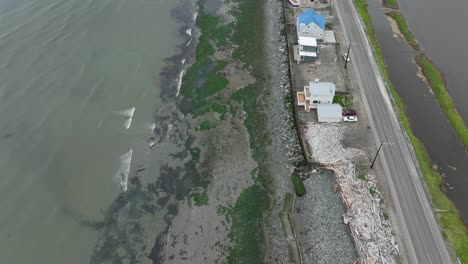 Aerial-view-looking-down-at-the-houses-on-West-Beach-Road-on-Whidbey-Island