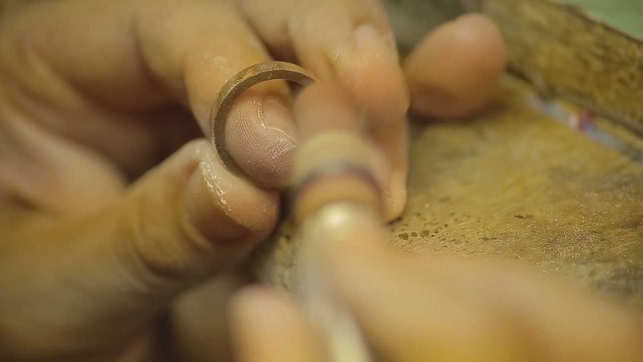 Italian Goldsmith at work building an engagement or a wedding ring