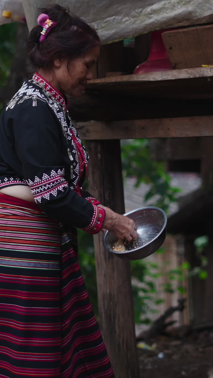 Woman in Traditional Clothing Holding a Bowl