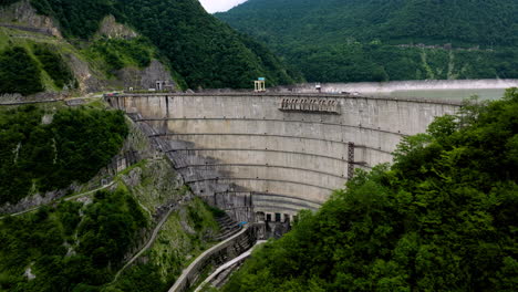 enguri dam, a hydroelectric dam on the enguri river in tsalenjikha, georgia - aerial drone shot