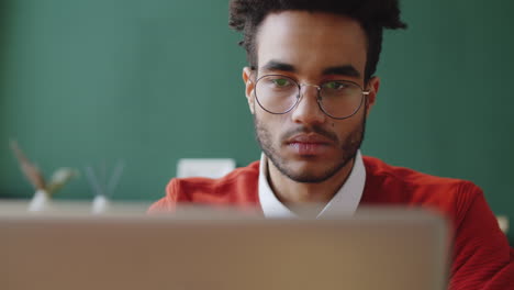 young man working on laptop